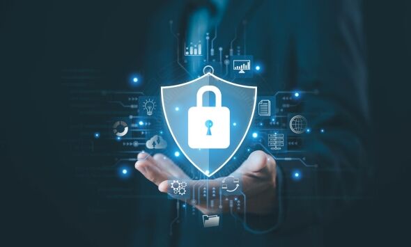 A person's hand is shown holding a digital shield with a lock icon, surrounded by various cybersecurity and data