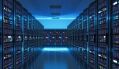 A vast server room with rows of glowing computer racks stretches into the distance, illuminated by cool blue lighting.