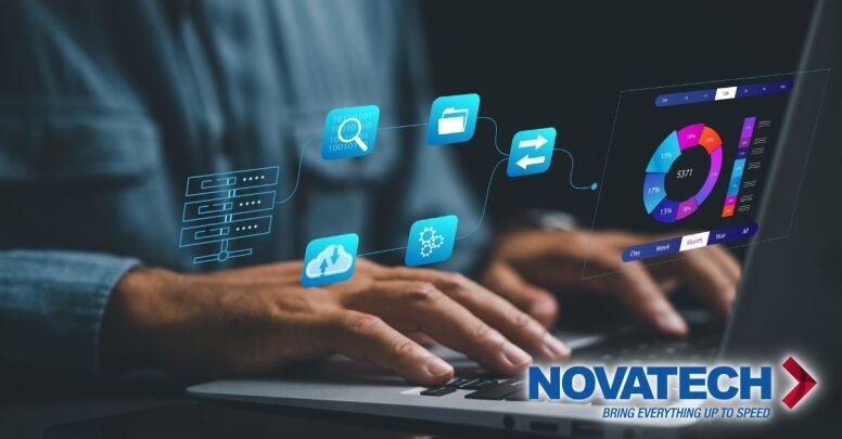 A person's hands type on a laptop, interacting with a futuristic holographic interface displaying data analytics and