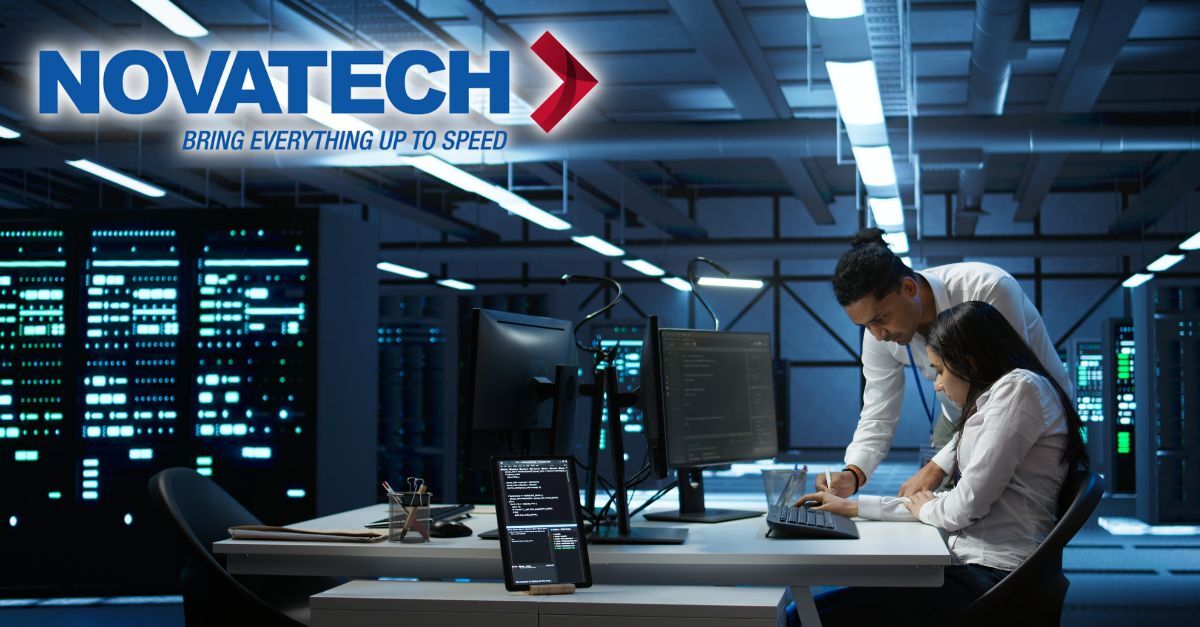 Two IT professionals collaborate in a server room, with the Novatech logo prominently displayed, indicating a focus on