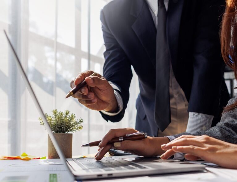 Two professionals collaborate