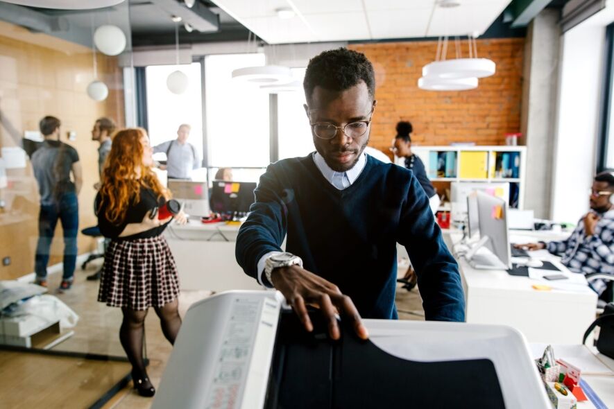 A man operates a printer in