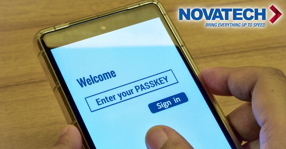 A hand holds a smartphone displaying a login screen with the text 