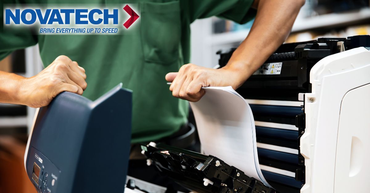A technician is shown working on a printer, with the Novatech logo prominently displayed.