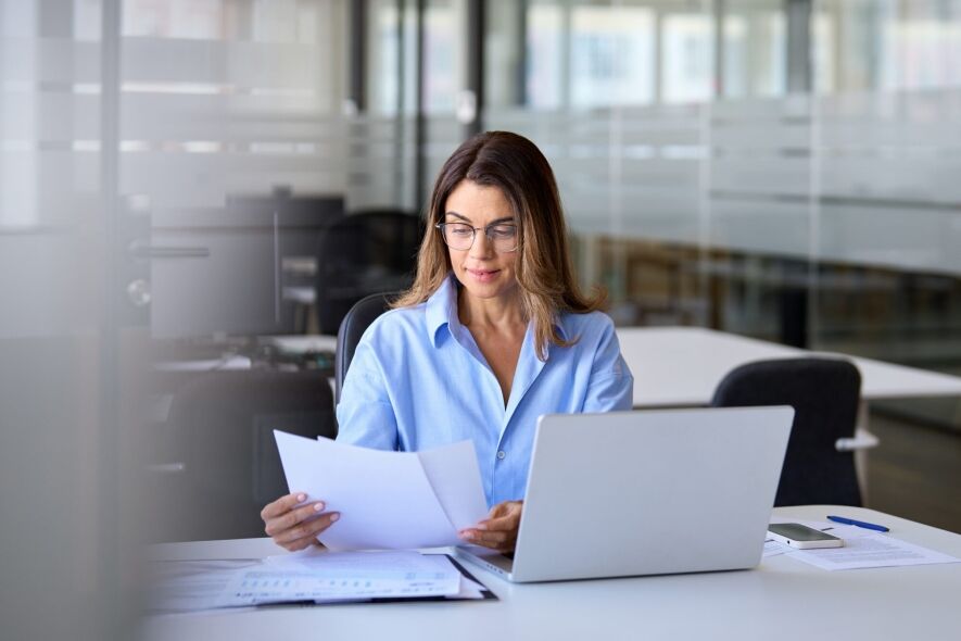 A focused businesswoman in glasses