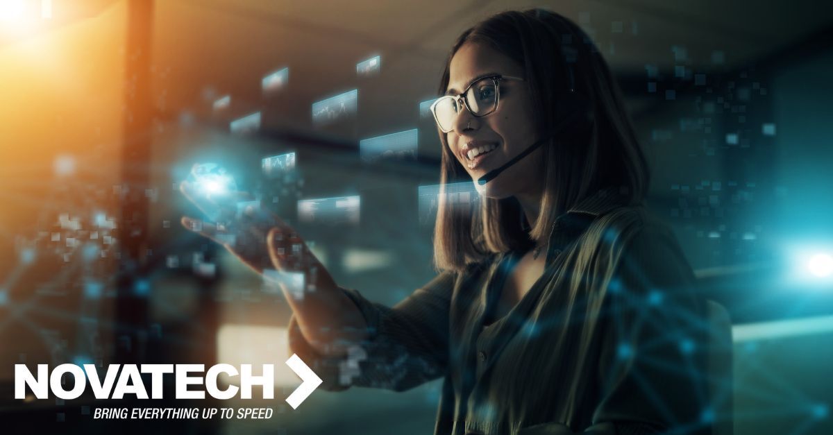 A smiling woman wearing a headset and glasses interacts with multiple glowing holographic data displays in a futuristic