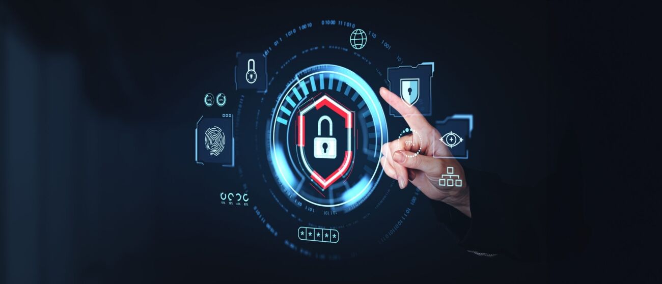 A person's finger interacts with a futuristic digital interface displaying security icons and data.