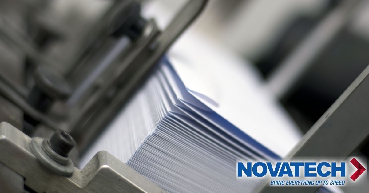 A close-up shot shows a stack of white envelopes being processed by industrial machinery, with the Novatech logo and