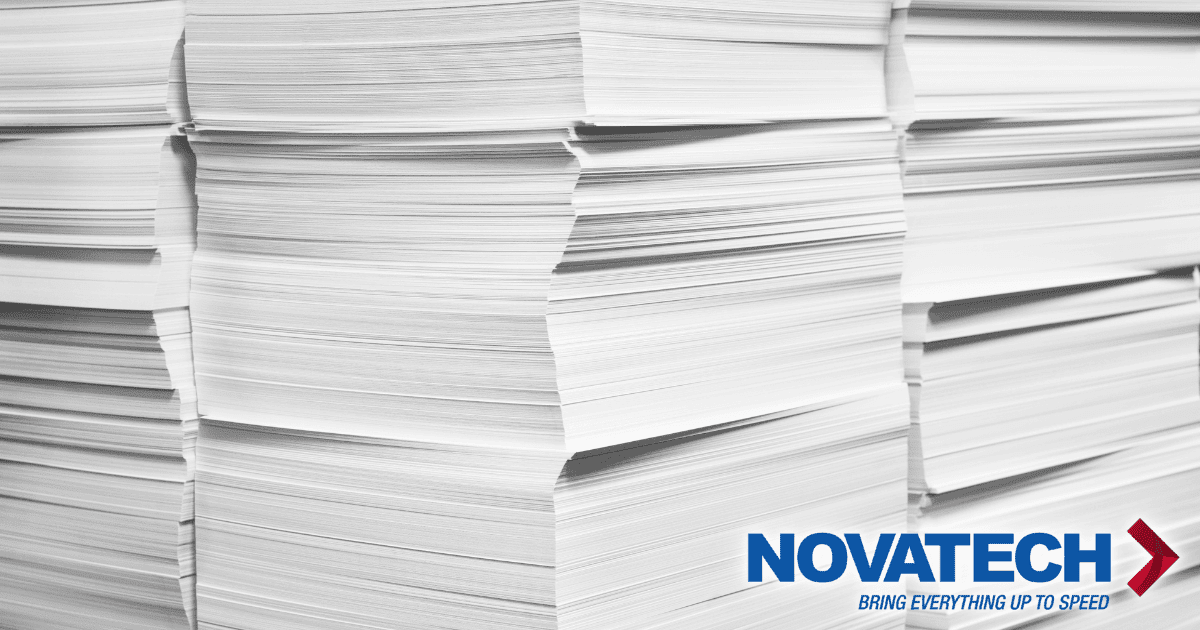 Stacks of white paper are shown with a logo and tagline at the bottom right.