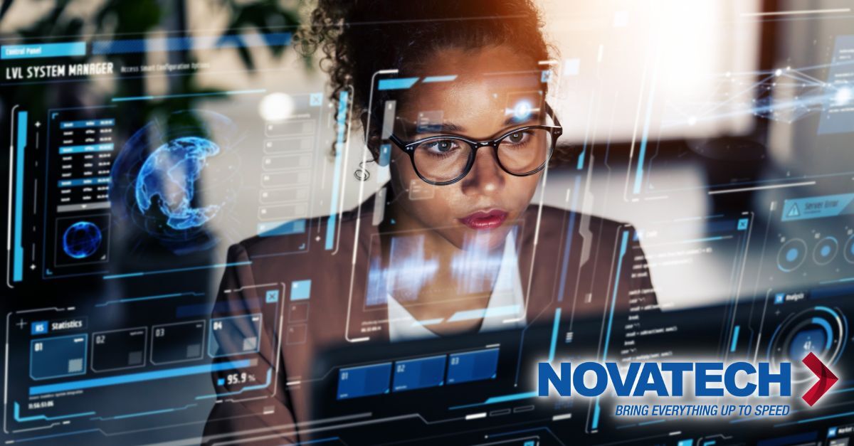 A woman intently monitors a futuristic, data-rich holographic interface displaying complex system information and