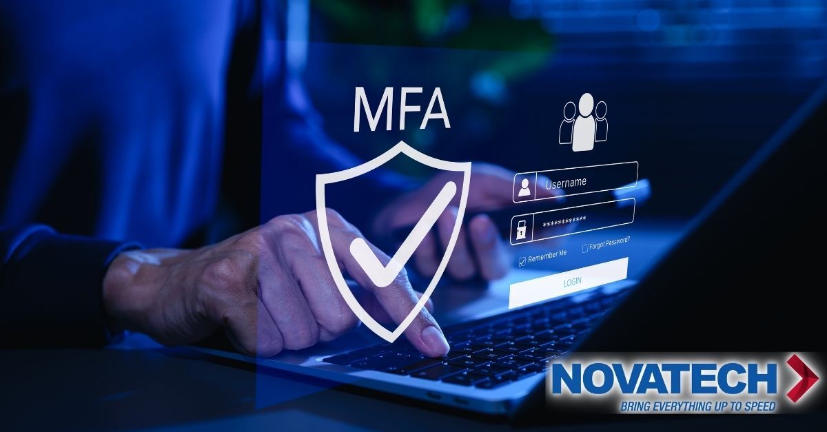 A person is using a laptop with a digital security interface showing a login screen with MFA (Multi-Factor