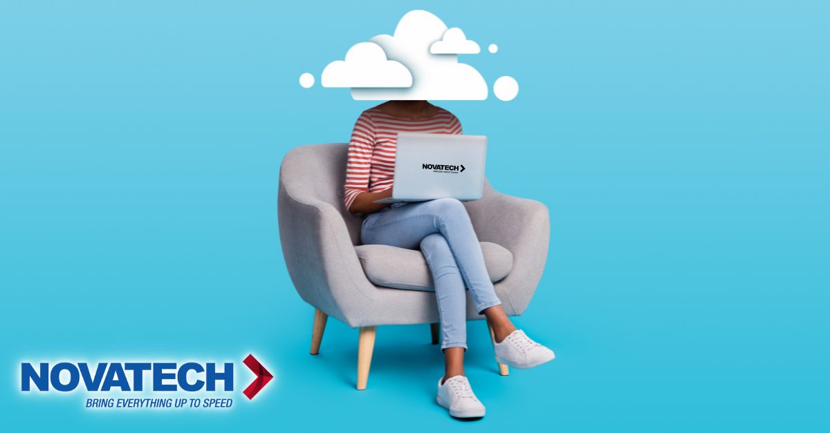 A person with a cloud for a head sits in an armchair, diligently working on a Novatech-branded laptop, symbolizing the