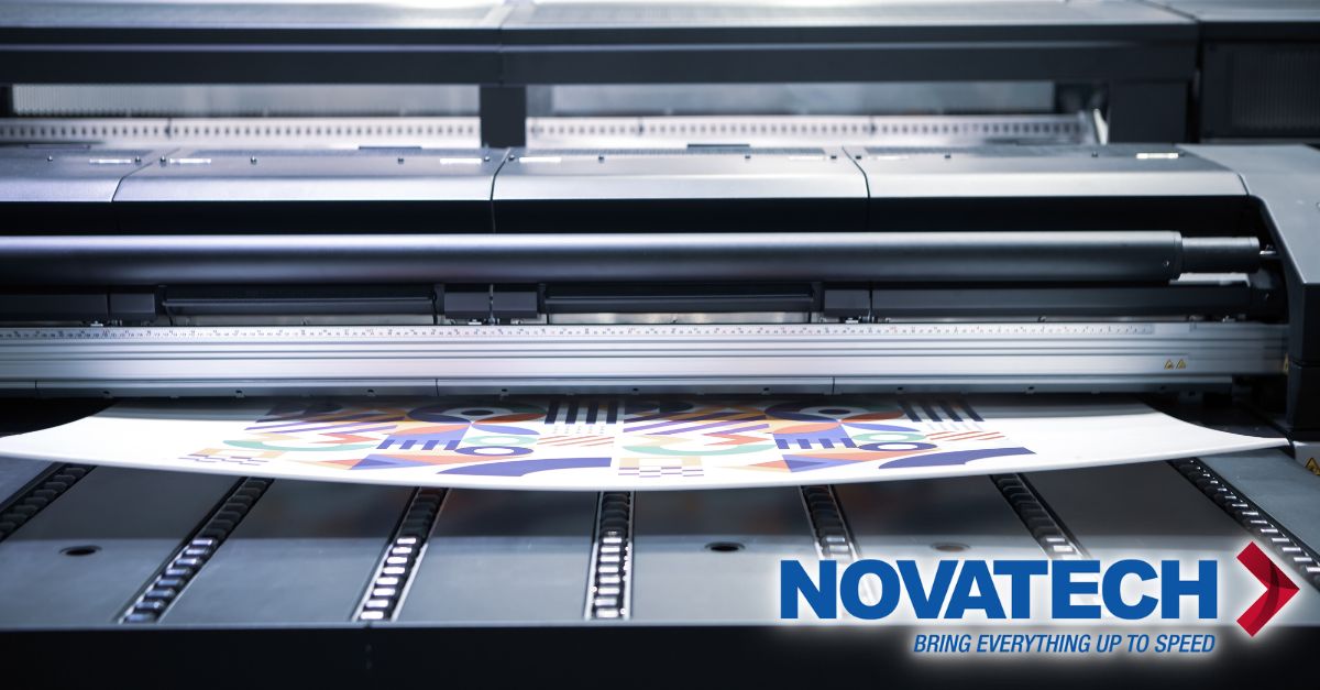A professional-grade printer is shown in operation, creating a colorful, abstract design on a large sheet, with the
