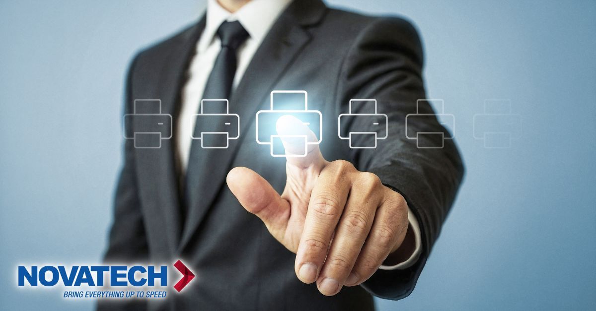 A businessman in a suit touches a glowing printer icon, symbolizing technology or a service.