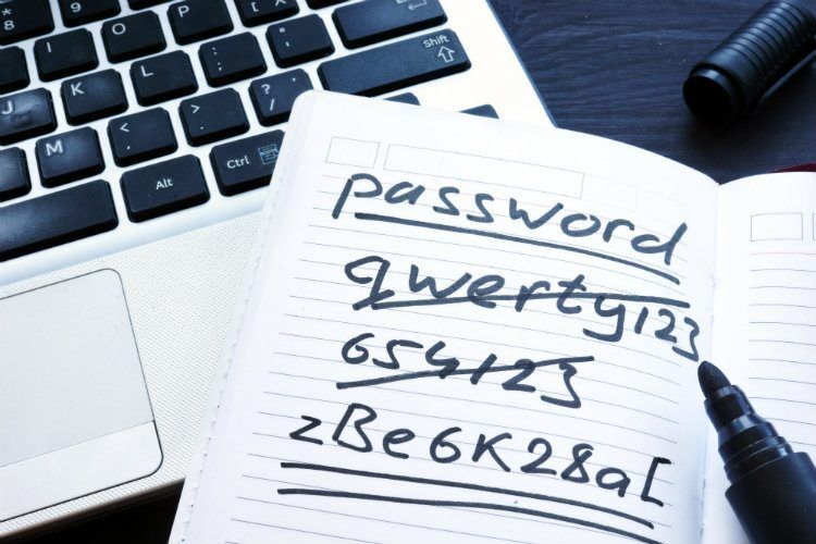A notebook with handwritten passwords, including